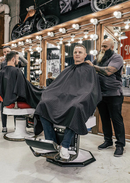 Barber Strong™ Classic Barber Cape – Black/White Pinstripe | NanoShield Anti-Static Cutting Cape for Professional Barbers