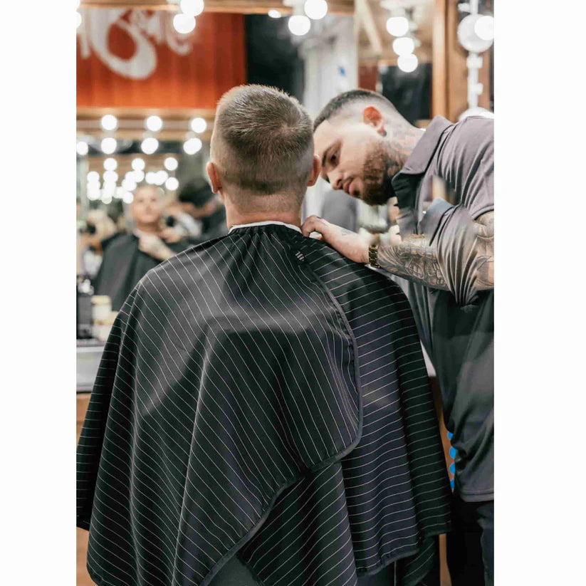 Barber Strong™ Classic Barber Cape – Black/White Pinstripe | NanoShield Anti-Static Cutting Cape for Professional Barbers